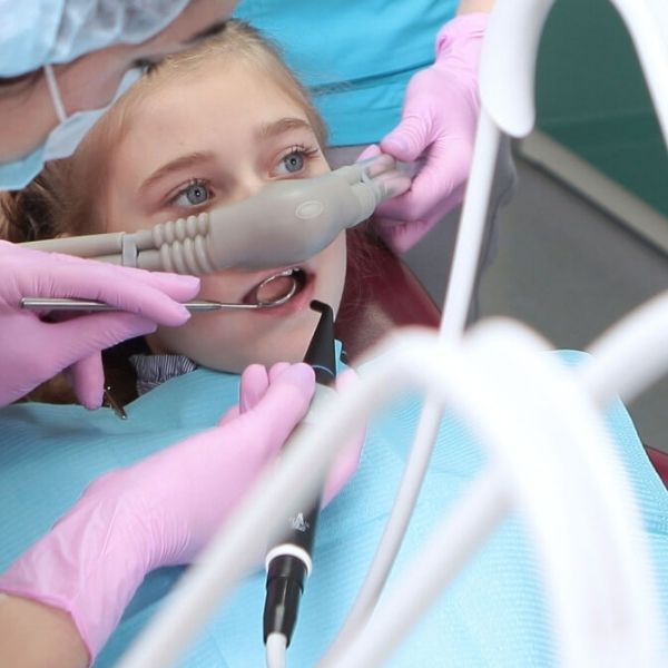 Child receiving gentle dental care