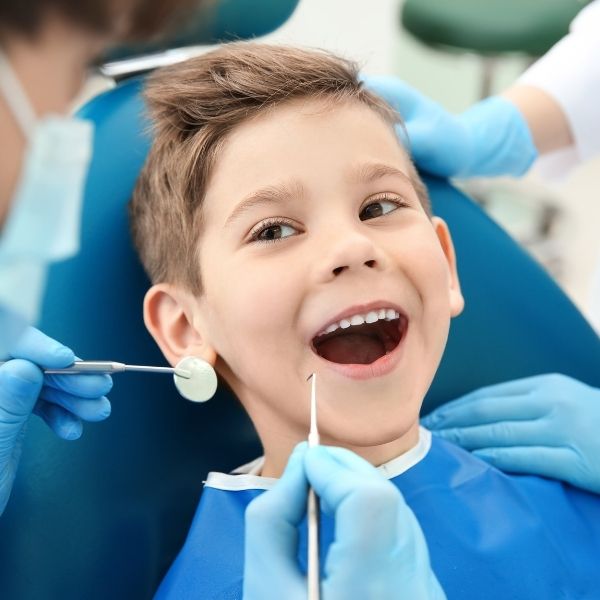 Child smiling during dental visit at Dental Sedation Ottawa