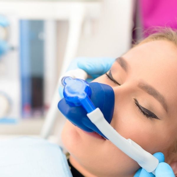 Patient comfortably breathing nitrous oxide through nasal mask at Dental Sedation Ottawa